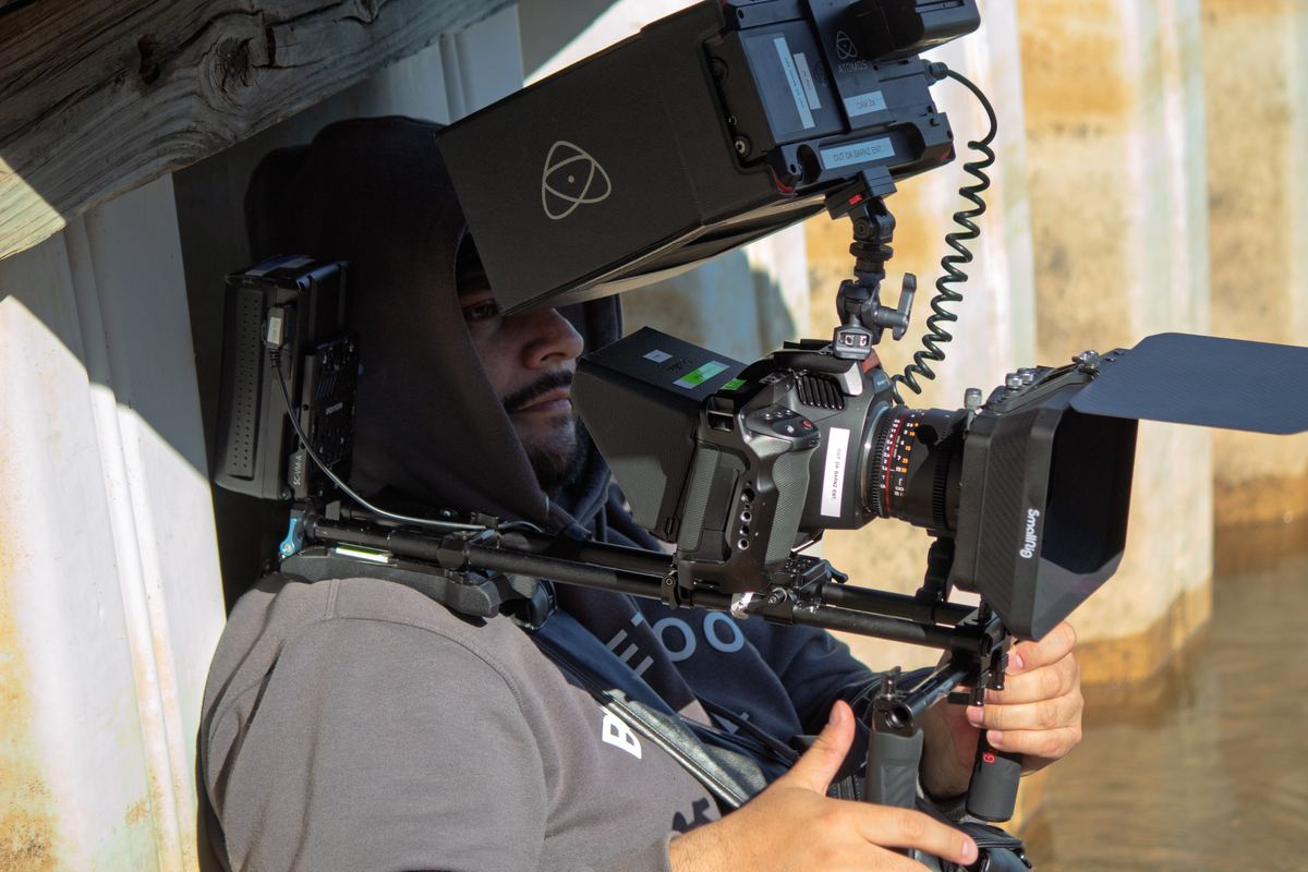 Rolling on location — the camera team lines up a shot