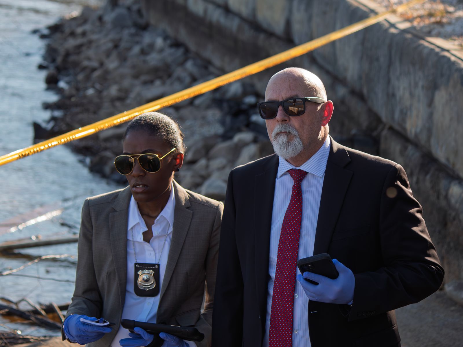 Two detectives at the lakeside crime scene in CHOICES